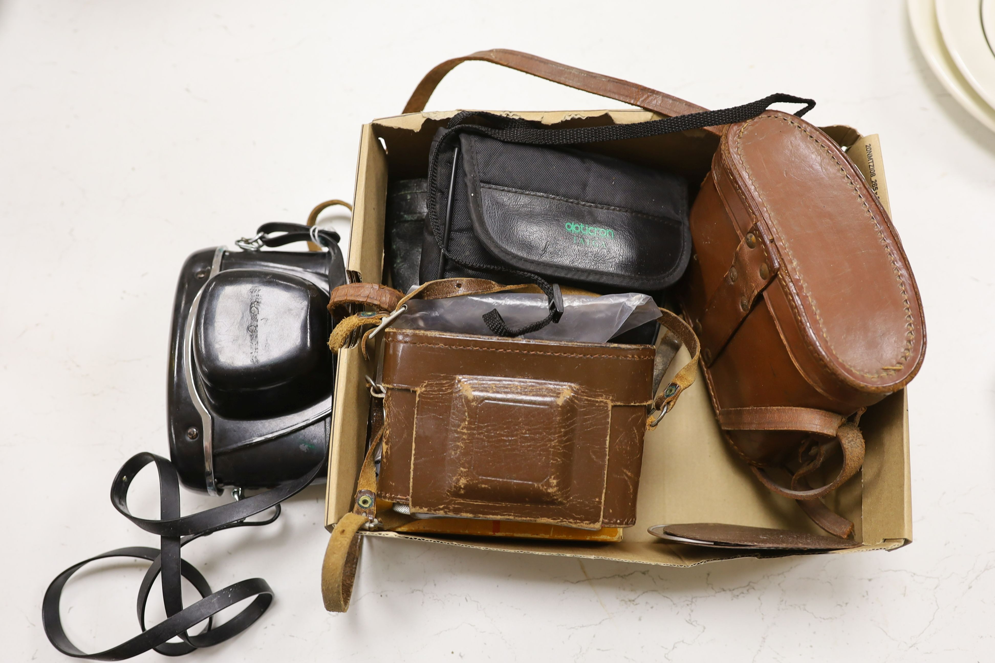 A pair of Taiga binoculars, various cameras etc.